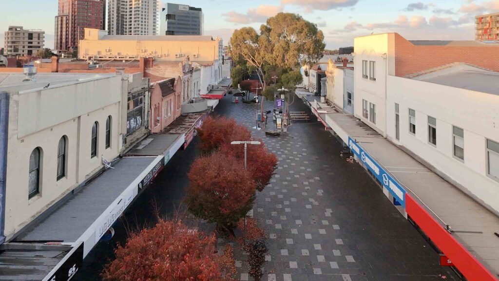 A high-angle view of the Nicholson Street Mall at sunset, highlighting the urban character and the stone-paved pedestrian thoroughfare supplied by Eigen Stones.