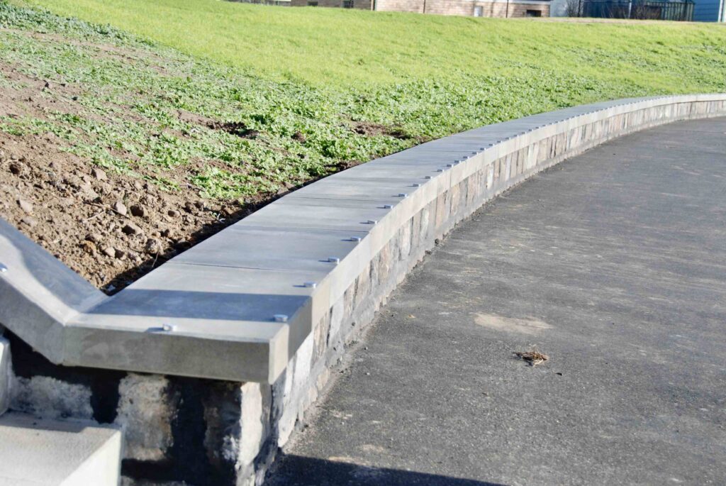 An elevated view of Burke Place, highlighting how the "digital confetti" stone paving from Eigen Stones creates a shared zone for pedestrians and slow-moving traffic.