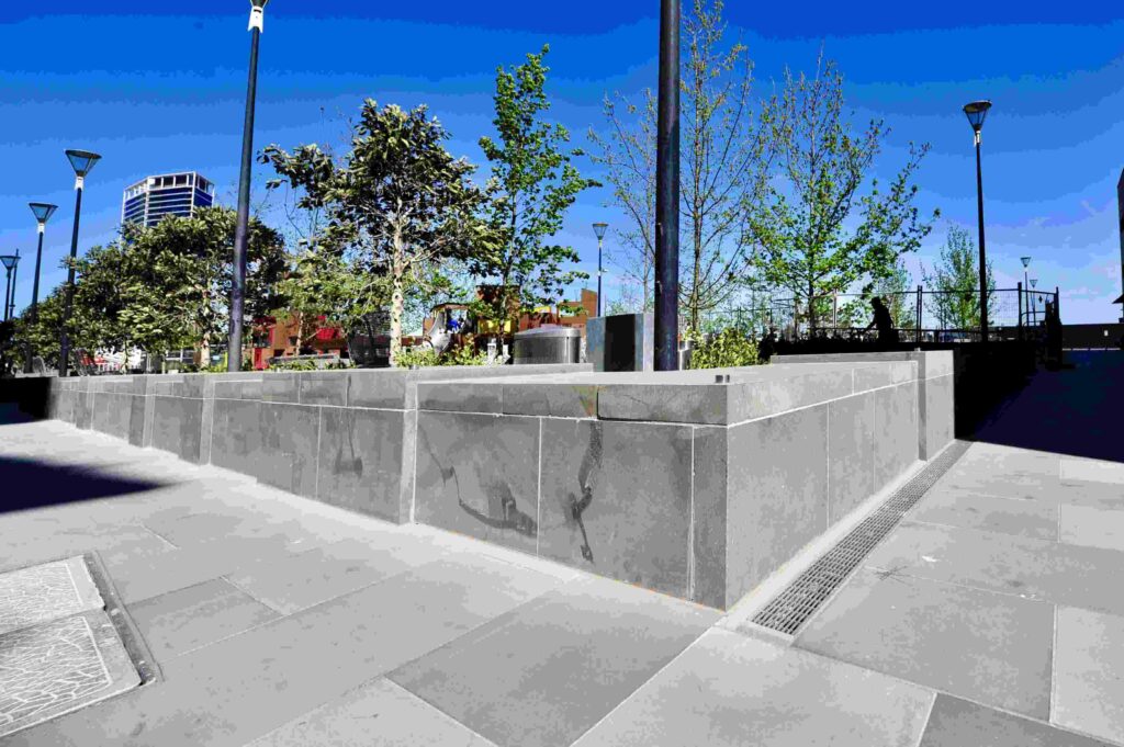 A detailed corner view of the large, solid stone blocks used for retaining and planter walls in Dockland Park, supplied by Eigen Stones.
