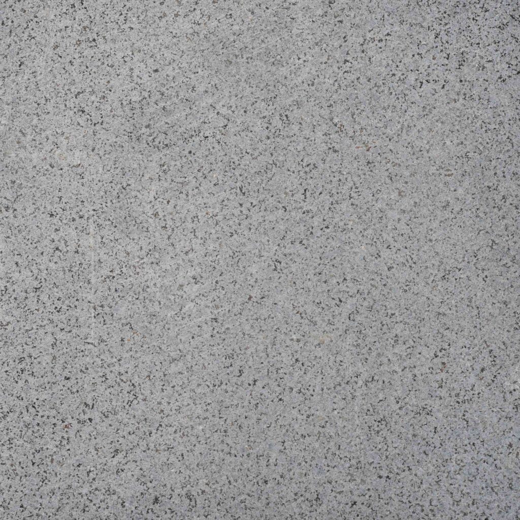 Barramundi_Sawn.jpg: A detailed photograph of the Barramundi Sawn Cut stone paver, showcasing its smooth, consistent surface and cool, minimalist grey tones.