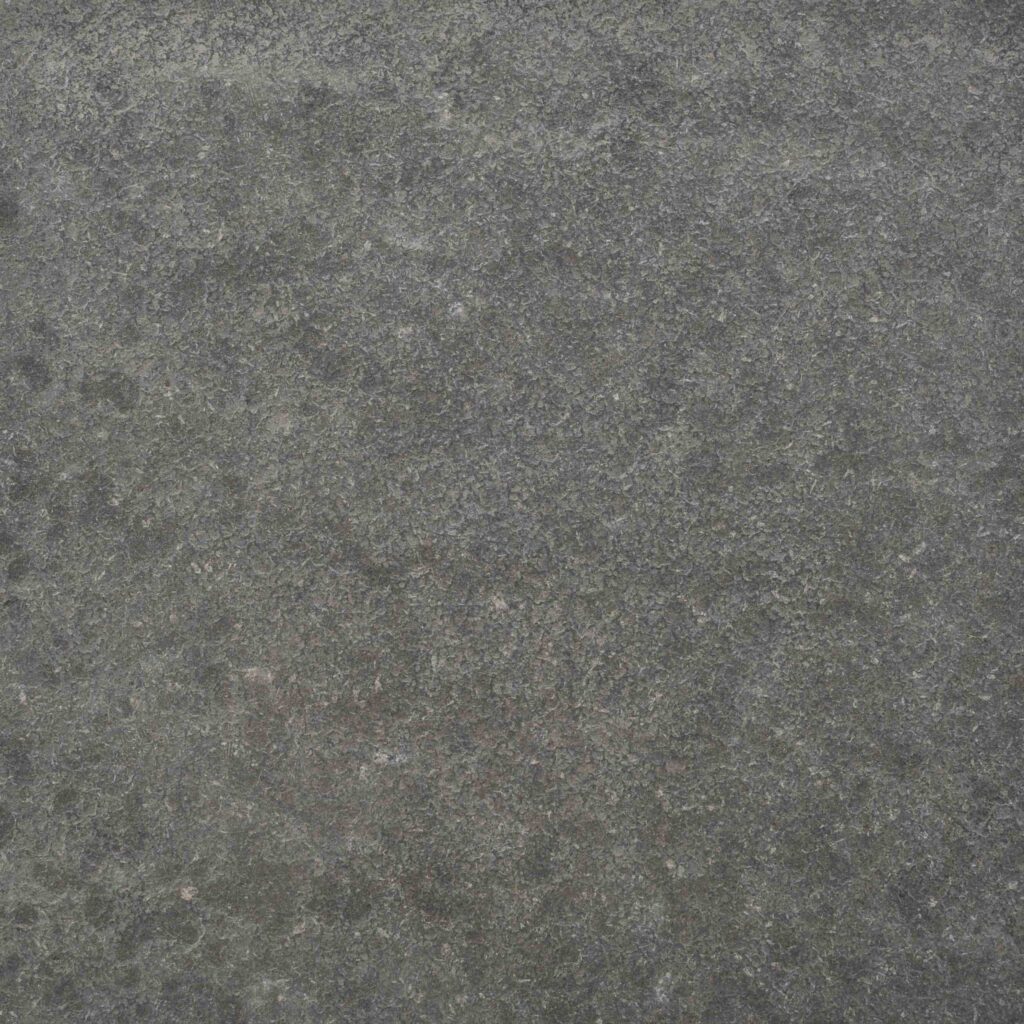 Raven_Exfoliated.jpg: A close-up texture shot of the Raven Flamed (Exfoliated) paver, highlighting its dark, dramatic, and ruggedly beautiful surface.